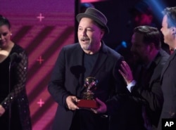 Ruben Blades accepts the award for album of the year for "Salsa Big Band" at the 18th annual Latin Grammy Awards at the MGM Grand Garden Arena, Nov. 16, 2017, in Las Vegas.