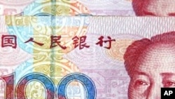 Official: US Sees Progress on Chinese Yuan, But Not Yet Satisfied