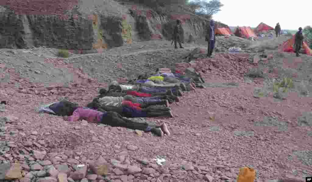 Bodies of the Kenyans attacked by Islamist extremists lie at a quarry in Mandera County, Kenya, Dec. 2, 2014.