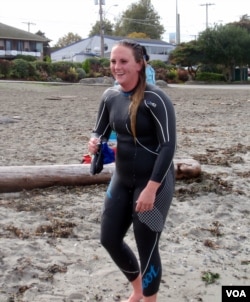 Kelly Reynolds of Seattle is seen after her first distance swim in Puget Sound. (VOA / T. Banse)