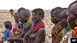 Turkana women wait for food relief at Kalok Tonyang in the Turkana district northwest of Nairobi, August 9, 2011