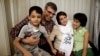 FILE - Reza Khandan, left, and his wife, Nasrin Sotoudeh, one of Iran’s most prominent human rights lawyers, in Tehran, Sept. 18, 2013.