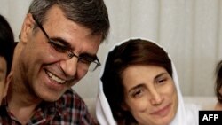 FILE - Reza Khandan, left, and his wife, Nasrin Sotoudeh, one of Iran’s most prominent human rights lawyers, in Tehran, Sept. 18, 2013. Khandan was arrested, Sept. 4, 2018, after he had publicly campaigned for the release of Sotoudeh, who had been detained in June. 