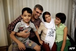 FILE - Reza Khandan, left, and his wife, Nasrin Sotoudeh, one of Iran’s most prominent human rights lawyers, are seen in Tehran, Sept. 18, 2013.