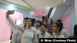 Music students in Syria’s Qamishli pose for a selfie with Gani Mirzo, July 2018.