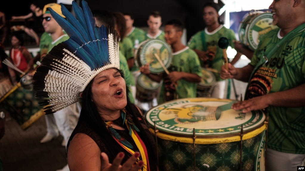 Sonia Guajajara (L), coordinator of the Articulation of the Indigenous Peoples of Brazil, and other indigenous leaders participate in the press conference given by the Imperatriz Leopoldinense samba school, whose theme this year pays homage to the native people of Brazil's Amazon region, ahead of the carnival parade at Cidade do Samba in Rio de Janeiro, Brazil, Feb. 24, 2017.