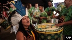 Sonia Guajajara (L), coordinator of the Articulation of the Indigenous Peoples of Brazil, and other indigenous leaders participate in the press conference given by the Imperatriz Leopoldinense samba school, whose theme this year pays homage to the native people of Brazil's Amazon region, ahead of the carnival parade at Cidade do Samba in Rio de Janeiro, Brazil, Feb. 24, 2017. 