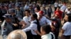 Student protesters confront police officers preventing them from joining another group of students in a monastery in Letpadan, north of Yangon, Myanmar, March 2. 2015. 