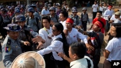 Student protesters confront police officers preventing them from joining another group of students in a monastery in Letpadan, north of Yangon, Myanmar, March 2. 2015. 