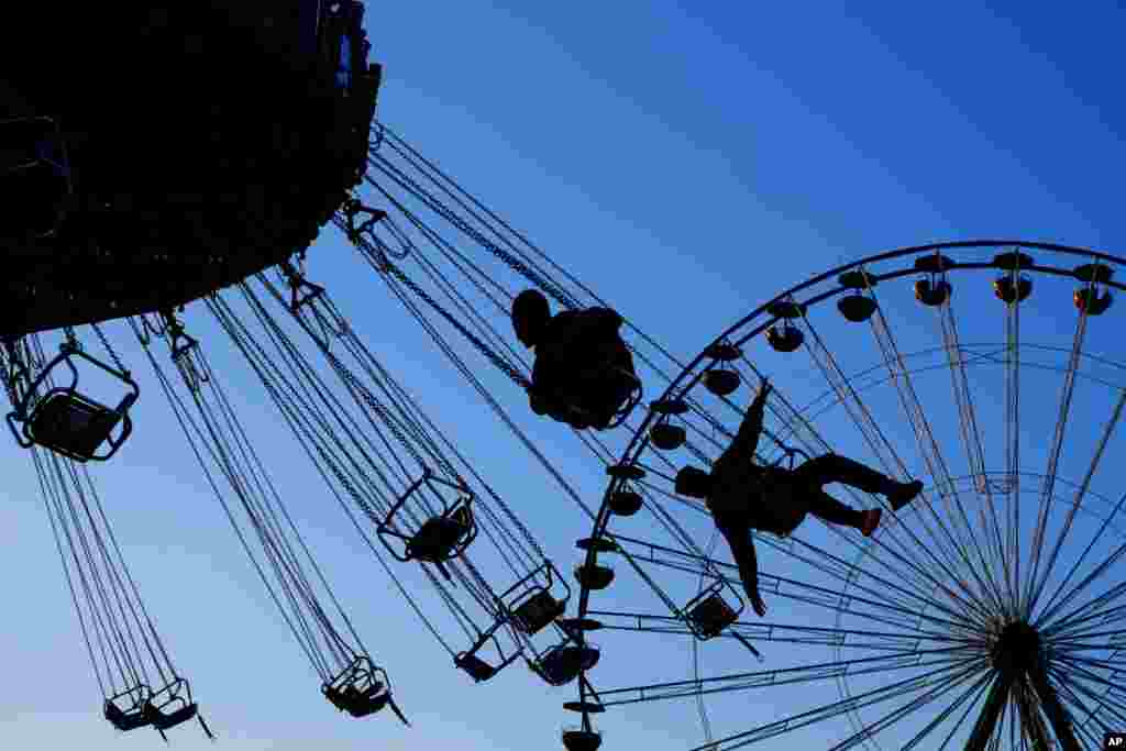 People enjoy the Christmas Lunapark in the capital Nicosia, in this eastern Mediterranean island of Cyprus, Dec. 3, 2016.