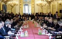 FILE - Foreign Ministers and members of the anti-Islamic State coalition meet on June 2, 2015 in Paris, to discuss strategy in fighting the jihadists who have made key battlefield advances in recent weeks in Iraq and Syria.