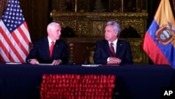 U.S. Vice President Mike Pence, left, and Ecuador's President Lenin Moreno exchange looks during the delivery of a final statement at the government palace in Quito, Ecuador, June 28, 2018.