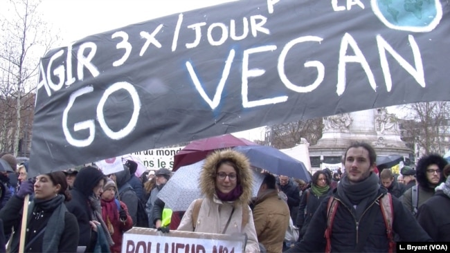 Demonstrators in Paris promote veganism as one way to curb greenhouse emissions.