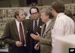 President Jimmy Carter shown April 1, 1979 in control room of the Three Mile Island nuclear plant in Middletown, Pa.