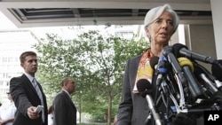 French Finance Minister Christine Lagarde speaks to the media outside the International Monetary Fund in Washington, June 23, 2011 (file photo).