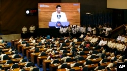 Philippine President Rodrigo Duterte is seen on a video screen during his third State of the Nation Address at the House of Representatives in Quezon city, metropolitan Manila, Philippines, July 23