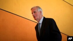 European Union chief Brexit negotiator Michel Barnier arrives for a session at European Parliament in Brussels, April 2, 2019. 