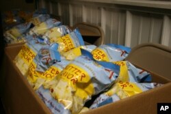 Packages of popcorn are shown in this Feb. 28, 2013, photo at Lakota Foods on the Lower Brule Indian Reservation in South Dakota.