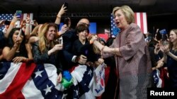 Democratic U.S. presidential candidate Hillary Clinton greets supporters as she arrives to address attendees at her New York presidential primary night rally in the Manhattan borough of New York City, U.S., April 19, 2016. 