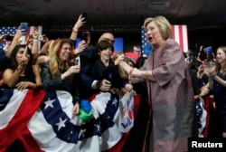 Democratic U.S. presidential candidate Hillary Clinton greets supporters as she arrives to address attendees at her New York presidential primary night rally in the Manhattan borough of New York City, U.S., April 19, 2016.