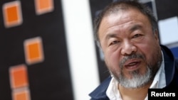 Chinese artist Ai Weiwei speaks to the media during a news conference ahead of an exhibition 'Chinese Whispers' at the Center Paul Klee in Bern, Switzerland on April 27, 2016.
