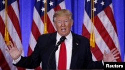  FILE - U.S. President-elect Donald Trump speaks during a news conference in the lobby of Trump Tower in New York, Jan. 11, 2017. 