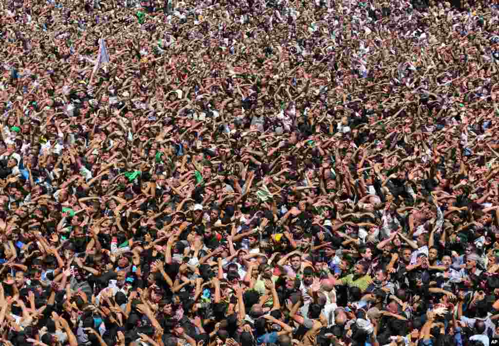 Shi'ite pilgrims beat themselves as a sign of grief at the holy shrine of the Imam Moussa al-Kadhim during the annual commemoration of the saint's death at Kazimiyah district of Baghdad, Iraq.