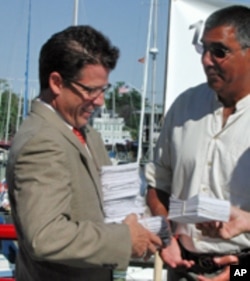 Outside his office in Annapolis, Environmental Protection Agency official Chuck Fox accepts 19,000 postcard petitions from citizens who call for stronger federal action in Bay restoration