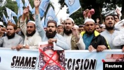 FILE - Members and supporters of the Muslim Student Organization (MSO) chant slogans during a protest after the Supreme Court overturned the conviction of a Christian woman sentenced to death for blasphemy against Islam, in Islamabad, Pakistan, Nov. 2, 2018. 