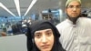 This July 27, 2014 photo provided by U.S. Customs and Border Protection shows Tashfeen Malik, left, and Syed Farook, as they passed through O'Hare International Airport in Chicago. The husband and wife died on Dec. 2, 2015, in a gun battle with authorities several hours after their assault on a gathering of Farook's colleagues in San Bernardino, Calif. 