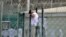 FILE - A detainee does pull-ups inside an exercise area at the U.S. detention facility at Guantanamo Bay, Cuba, April 27, 2010.