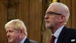 Britain's Prime Minister Boris Johnson, left, and main opposition Labour Party leader Jeremy Corbyn attend the official State Opening of Parliament in London, Oct. 14, 2019. 