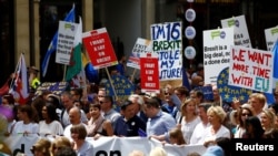 FILE - EU supporters, calling on the government to give Britons a vote on the final Brexit deal, participate in the 'People's Vote' march in central London, Britain June 23, 2018. 