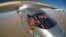 FILE - Selfie picture shows Swiss pioneer Bertrand Piccard during the last leg of the round the world trip with Solar Impulse 2 over the Arab peninsula, July 25, 2016.