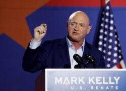FILE - Democratic U.S. Senate candidate Mark Kelly speaks at an election watch party in Tucson, Arizona, November 3, 2020.