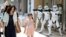 Pedestrians pass before Storm Troopers at a toy shop in Tokyo. May 4th is called the "Star Wars Day" among Star Wars fans as the famous phrase "May the Force be with you" in the movie sounds like "May the 4th be with you."
