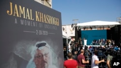 A picture of slain Saudi dissident and Washington Post columnist Jamal Kashoggi is seen during a ceremony near Saudi Arabia's consulate in Istanbul, Turkey, marking the one-year anniversary of his death, Oct. 2, 2019. 