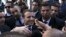 French President Emmanuel Macron shakes hands as he meets residents in Algiers, Wednesday, Dec.6, 2017. 