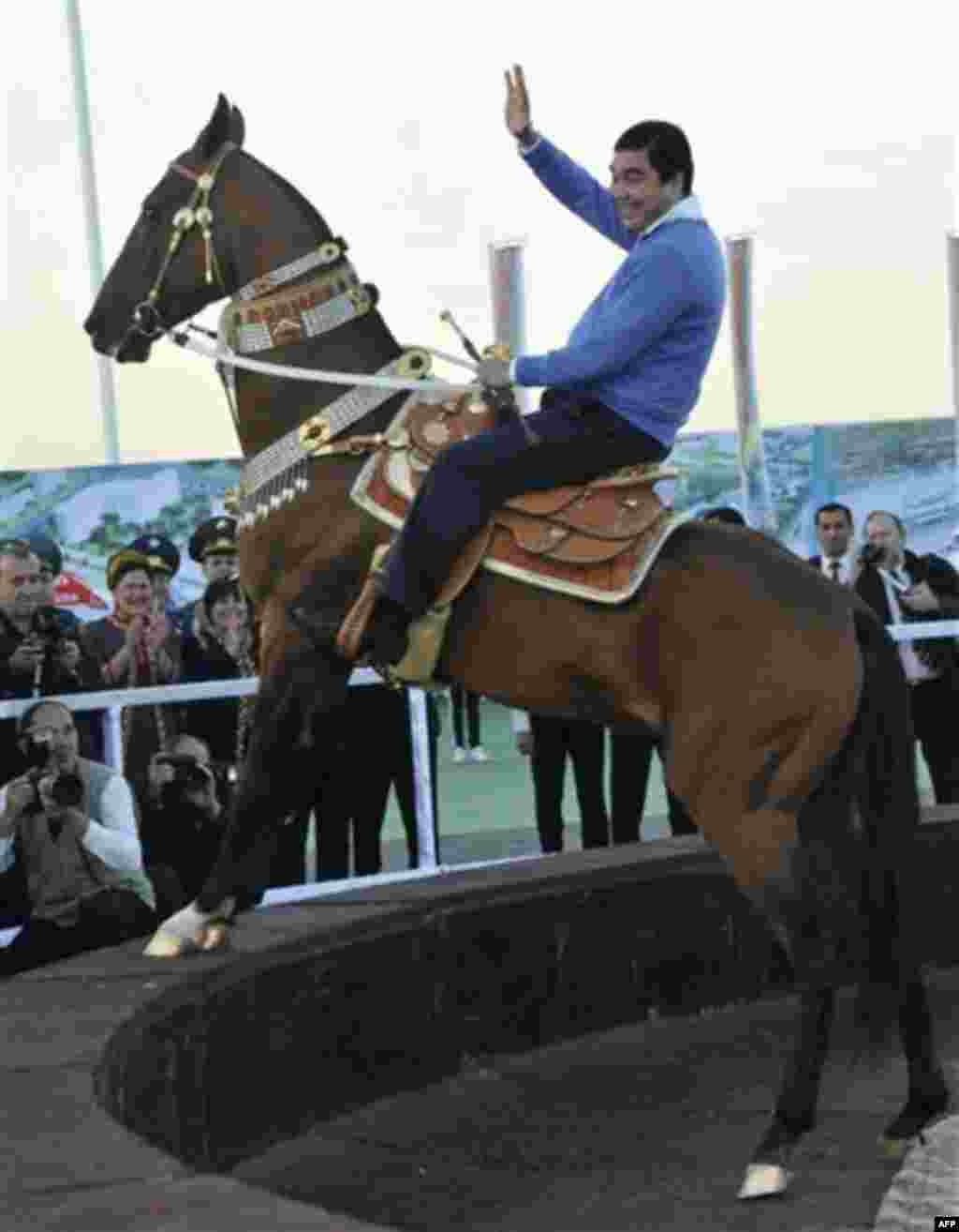 In this photo made Friday, Nov. 5, 2010, Turkmenistan's President Gurbanguli Berdymukhamedov rides a horse during the foundation-laying ceremony of an Olympic town in Ashgabat, Turkmenistan. The government of energy-rich Turkmenistan plans to spend 5 bil