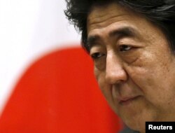 FILE PHOTO: Japan's Prime Minister Shinzo Abe holds a news conference in Tokyo