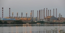 A general view of Abadan oil refinery in southwest Iran, is pictured from Iraqi side of Shatt al-Arab in Al-Faw south of Basra, Iraq Sept. 21, 2019.