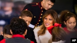 First lady Melania Trump joins children at the U.S. Marine Corps Reserve's Toys for Tots Drive at Joint Base Anacostia-Bolling in Washington, Dec. 9, 2019.