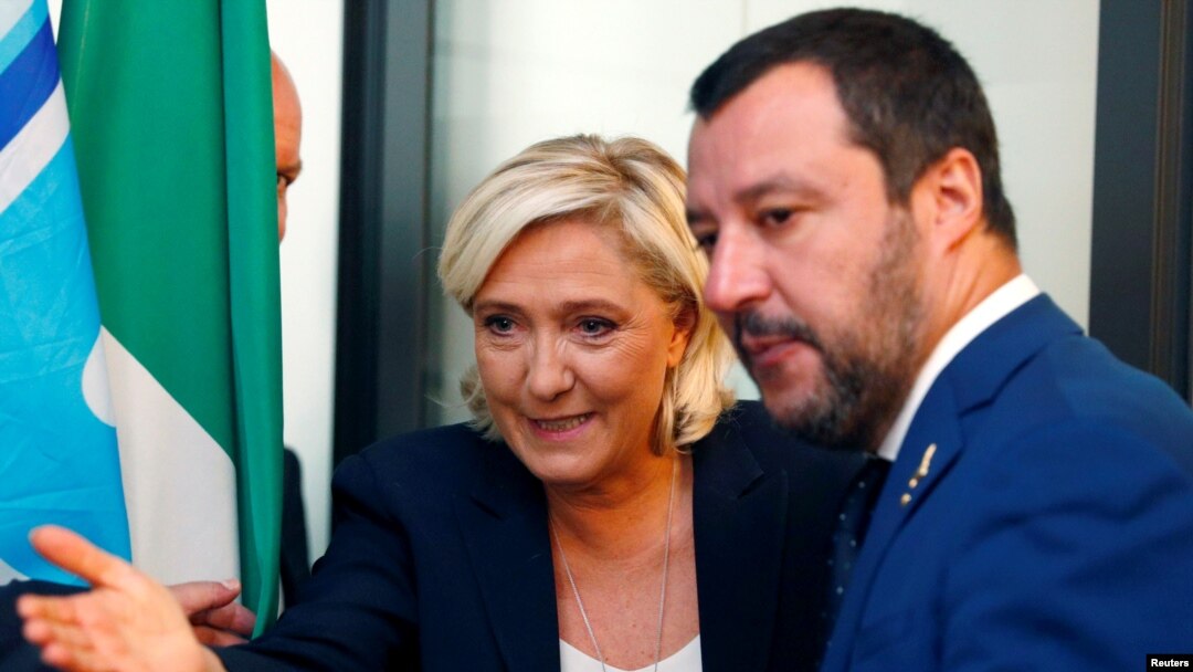 FILE - French far-right leader Marine Le Pen and Italy's far-right leader and interior minister, Matteo Salvini, arrive to hold a news conference in Rome, Oct. 8, 2018.