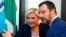 FILE - French far-right leader Marine Le Pen and Italy's far-right leader and interior minister, Matteo Salvini, arrive to hold a news conference in Rome, Oct. 8, 2018.