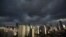 Dark clouds cover the sky in downtown Shanghai, August 6, 2012.