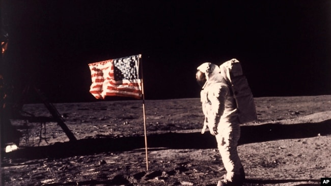 In this image provided by NASA, astronaut Buzz Aldrin poses for a photograph beside the U.S. flag deployed on the moon during the Apollo 11 mission on July 20, 1969. (Neil A. Armstrong/NASA via AP, File)