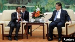 中国主席习近平在北京人民大会堂会见印度国家安全顾问多瓦尔（2014年9月9日）