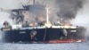 This undated photo released by the private security firm Ambrey shows the oil tanker Sounion burning in the Red Sea. 