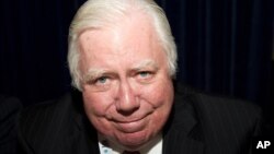 FILE - Jerome Corsi signs copies of his books at the Book Expo America in New York, May 25, 2011. 