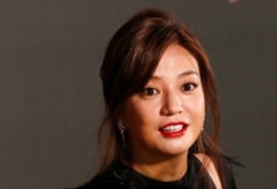 FILE - Actress Zhao Wei poses on the red carpet of the Hong Kong Film Awards in Hong Kong, April 9, 2017.